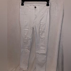 Ripped and patched white AE jeggings